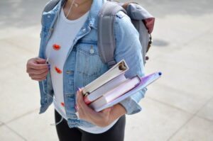 Person holding books